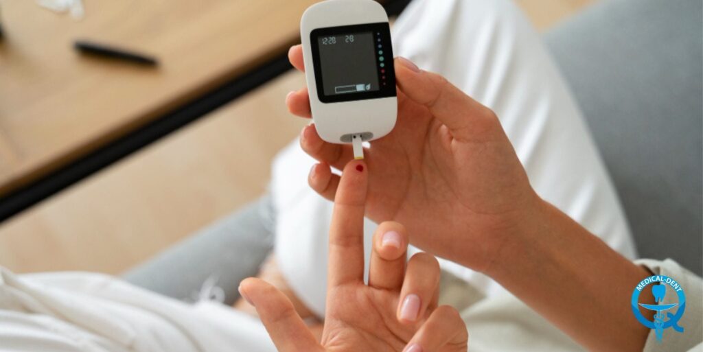 The image shows the hands of a person in a white medical gown holding a small electronic device, probably used to measure health parameters. A close-up of the hands is visible, as well as the screen of the device displaying some numerical values. A pen lies on the tabletop, suggesting that this is a scene from a doctor's or dentist's office.