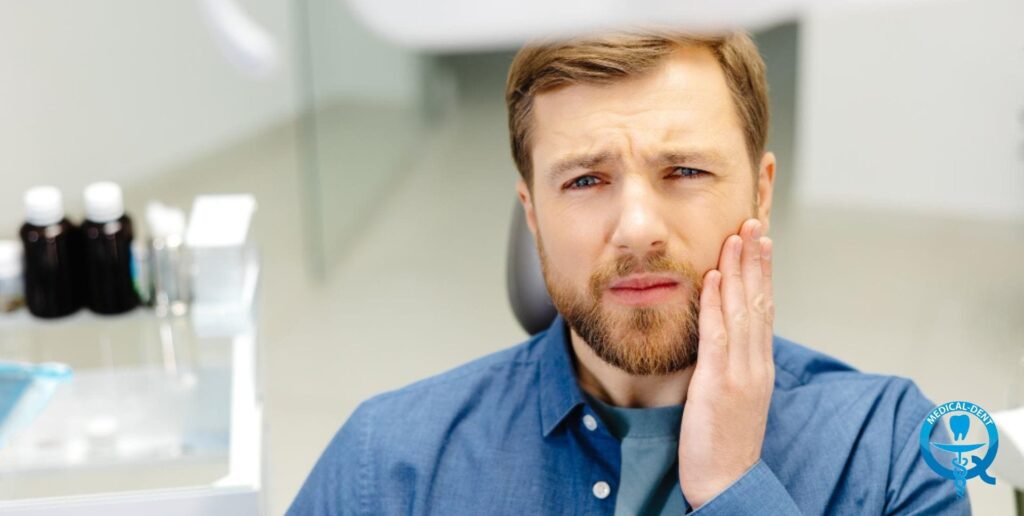 The painting depicts a man in a blue shirt who is a dentist. He can be seen in a professional dentist's office, with dental instruments in the background. The man has a beard and a thoughtful expression on his face, touching his cheek with his hand.